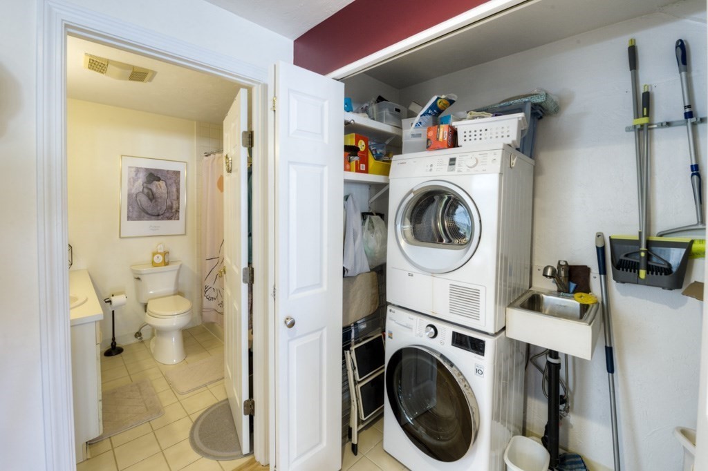44 Elm Street, Unit 501 Worcester, MA 01609 - Photo 24 of 41 a utility room with sink dryer and washer