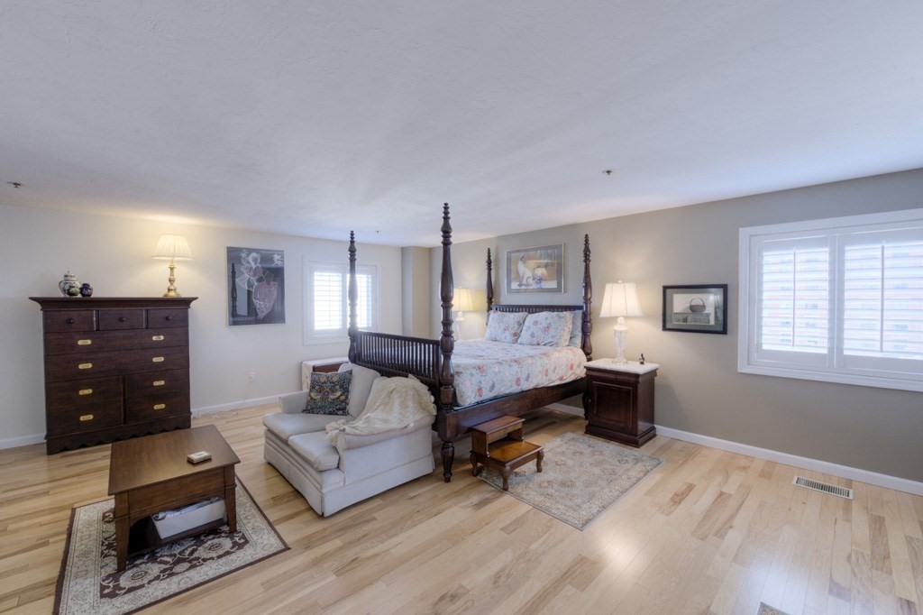 44 Elm Street, Unit 501 Worcester, MA 01609 - Photo 28 of 41 a living room with furniture and wooden floor