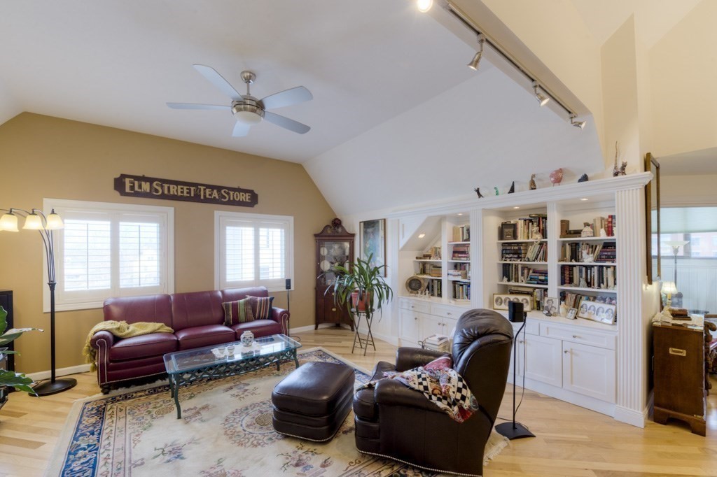 44 Elm Street, Unit 501 Worcester, MA 01609 - Photo 5 of 41 a living room with furniture or couch and a bookshelf