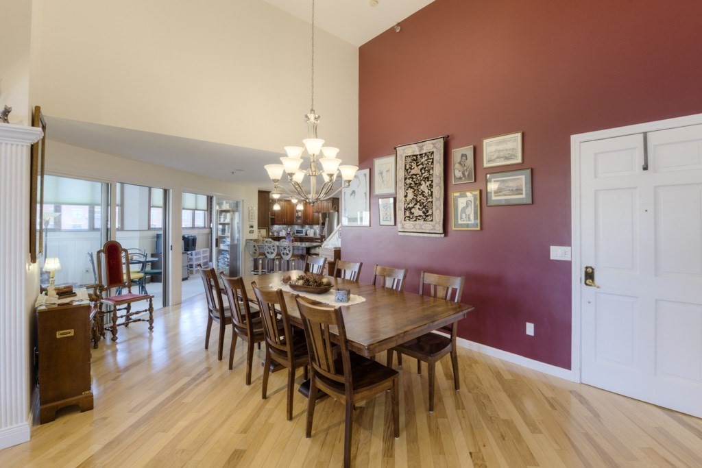 44 Elm Street, Unit 501 Worcester, MA 01609 - Photo 8 of 41 a view of a dining room with furniture and chandelier