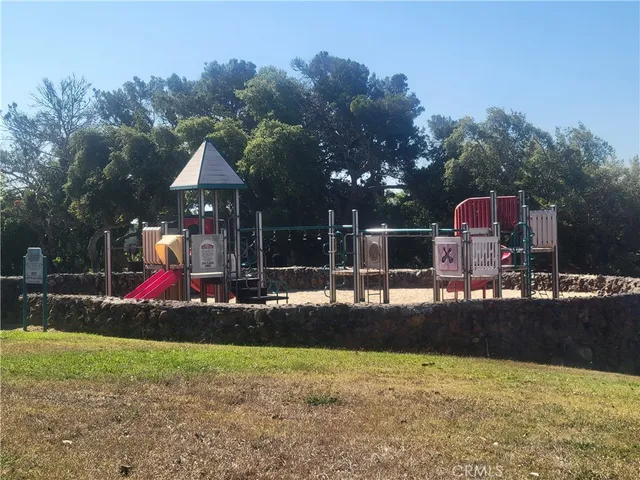 a view of a playground with basketball court