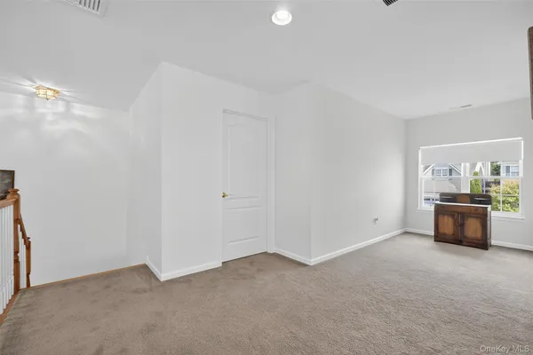 a living room with a couch and a stove top oven