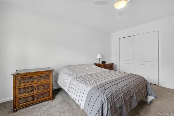 a bedroom with a bed and a cabinets