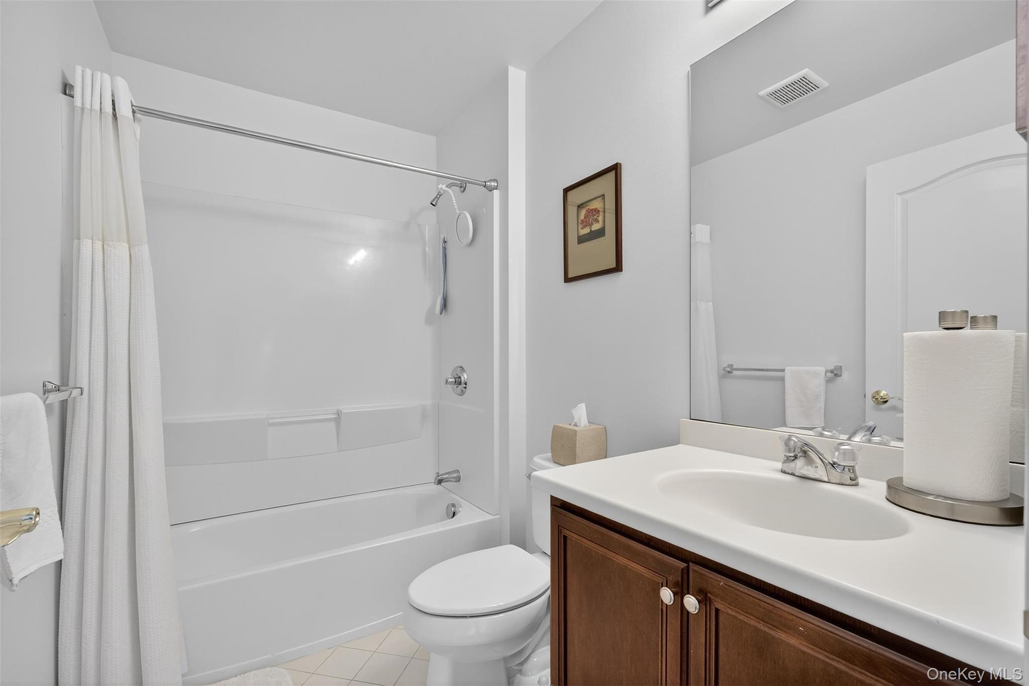 167 Stony Brook Road Fishkill, NY 12524 - Photo 26 of 42 Bathroom with shower / bath combo with shower curtain, vanity, and light tile patterned flooring