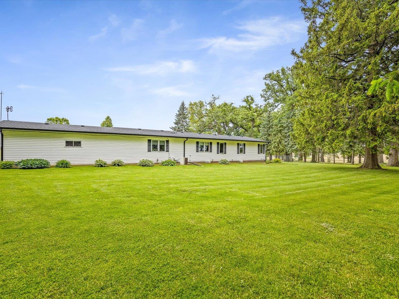 8500 Manchester Road Capron, IL 61012 - Photo 44 of 51 a view of a house with a lake view
