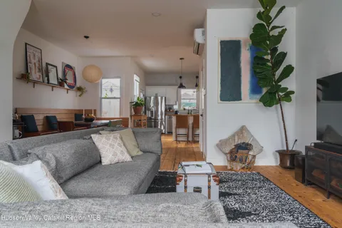 a living room with furniture and a rug