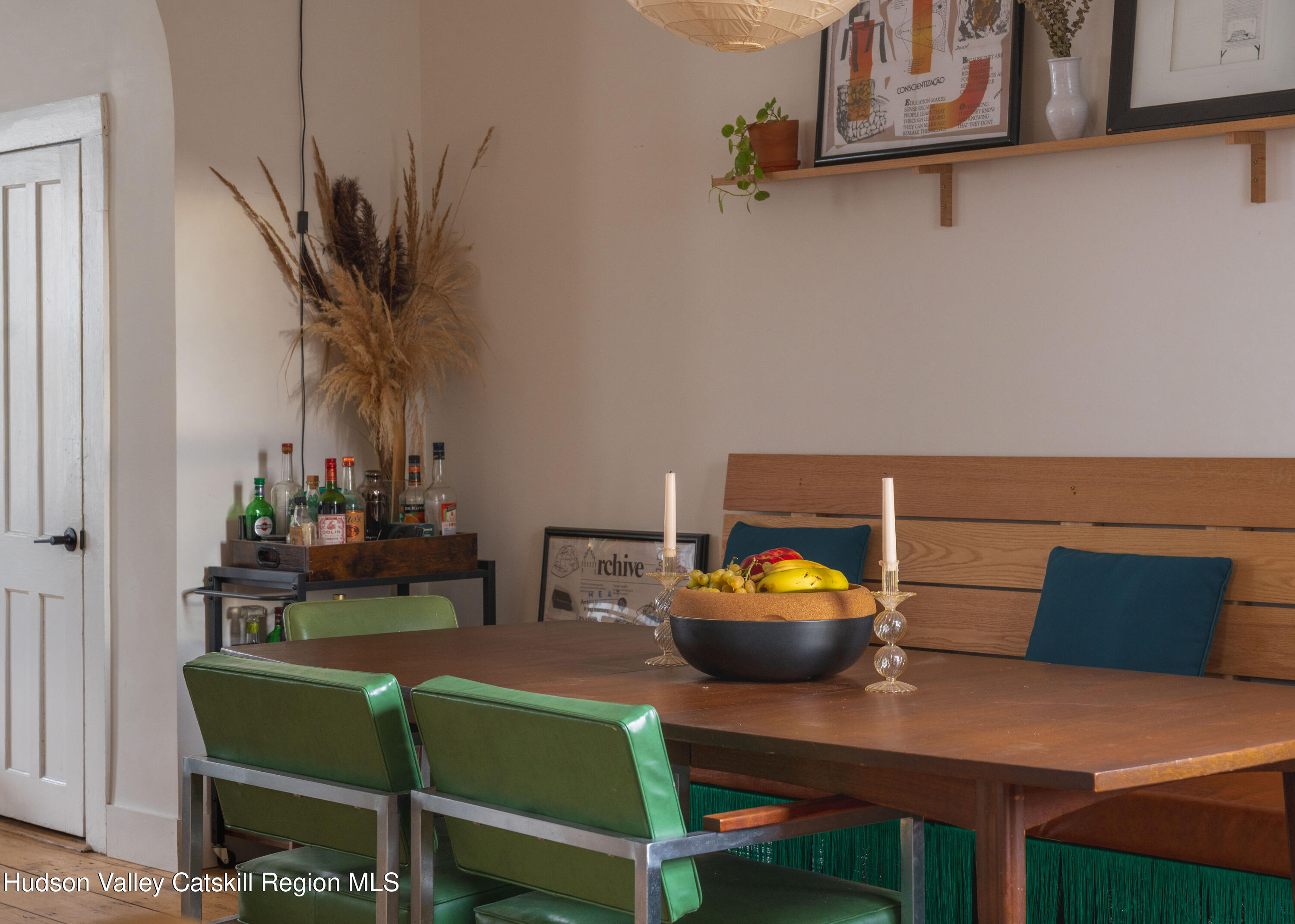 517 State Street Hudson, NY 12534 - Photo 16 of 36 a view of a dining room with furniture and a potted plant