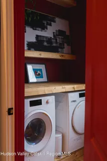 a close view of a utility room with dryer and washer