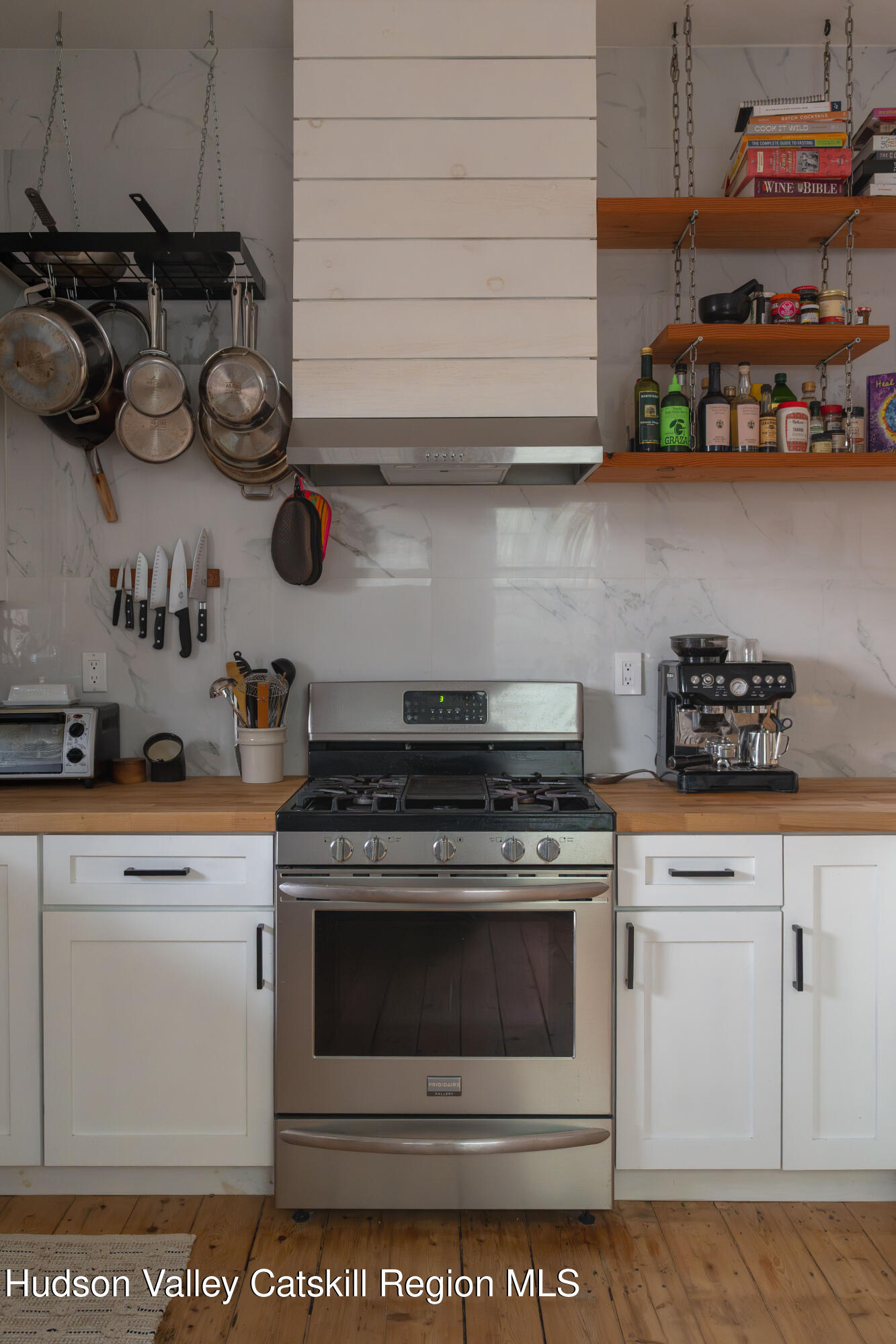 517 State Street Hudson, NY 12534 - Photo 20 of 36 a kitchen with appliances cabinets and a counter top