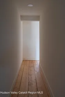 a bathroom with a sink a mirror and a window