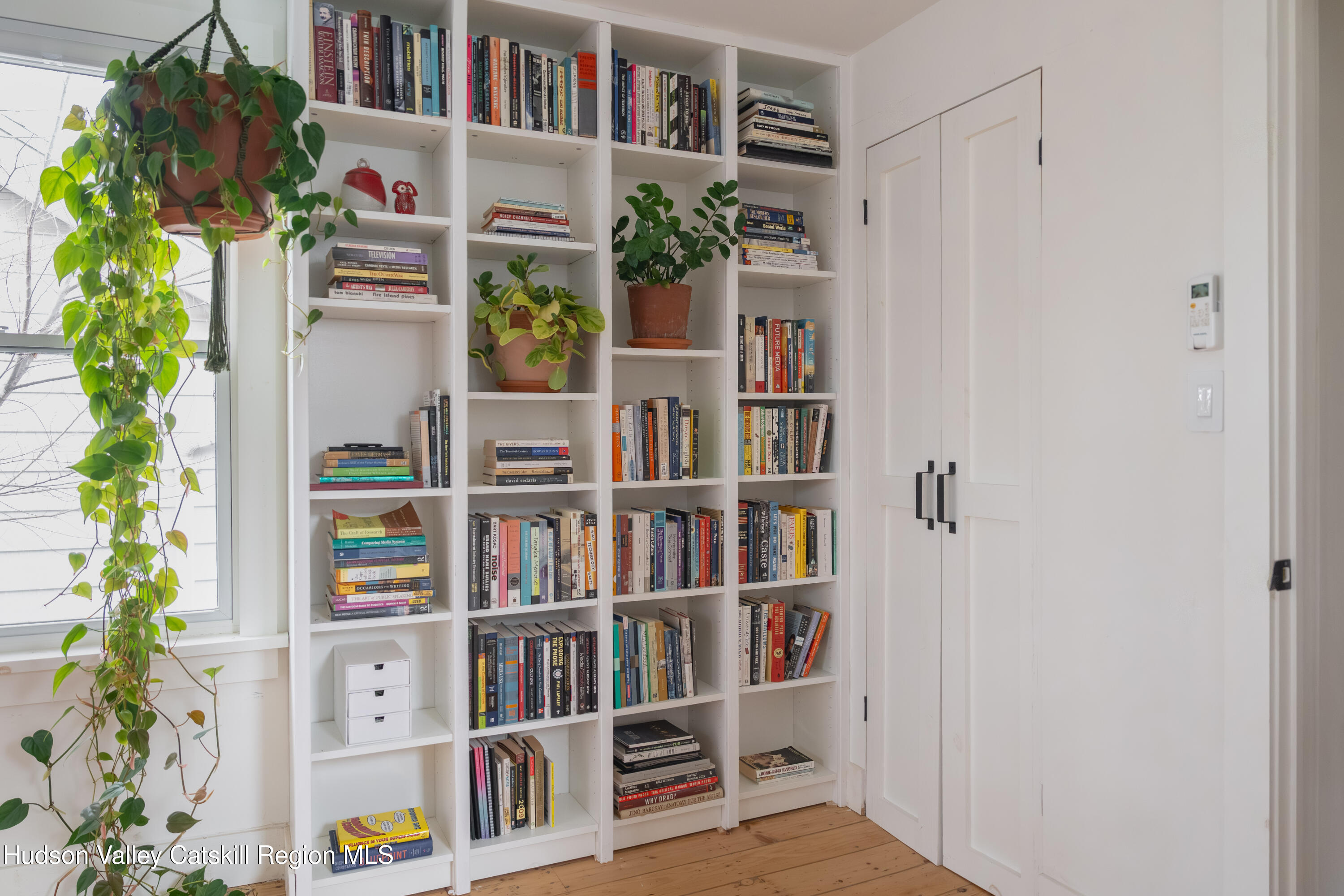 517 State Street Hudson, NY 12534 - Photo 32 of 36 a book shelf with books and a book shelf