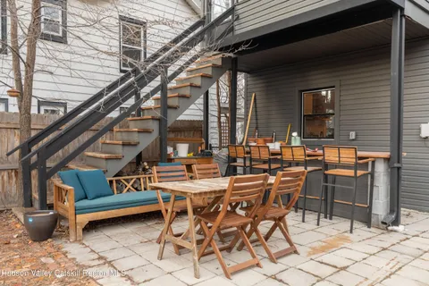 a view of backyard with wooden fence