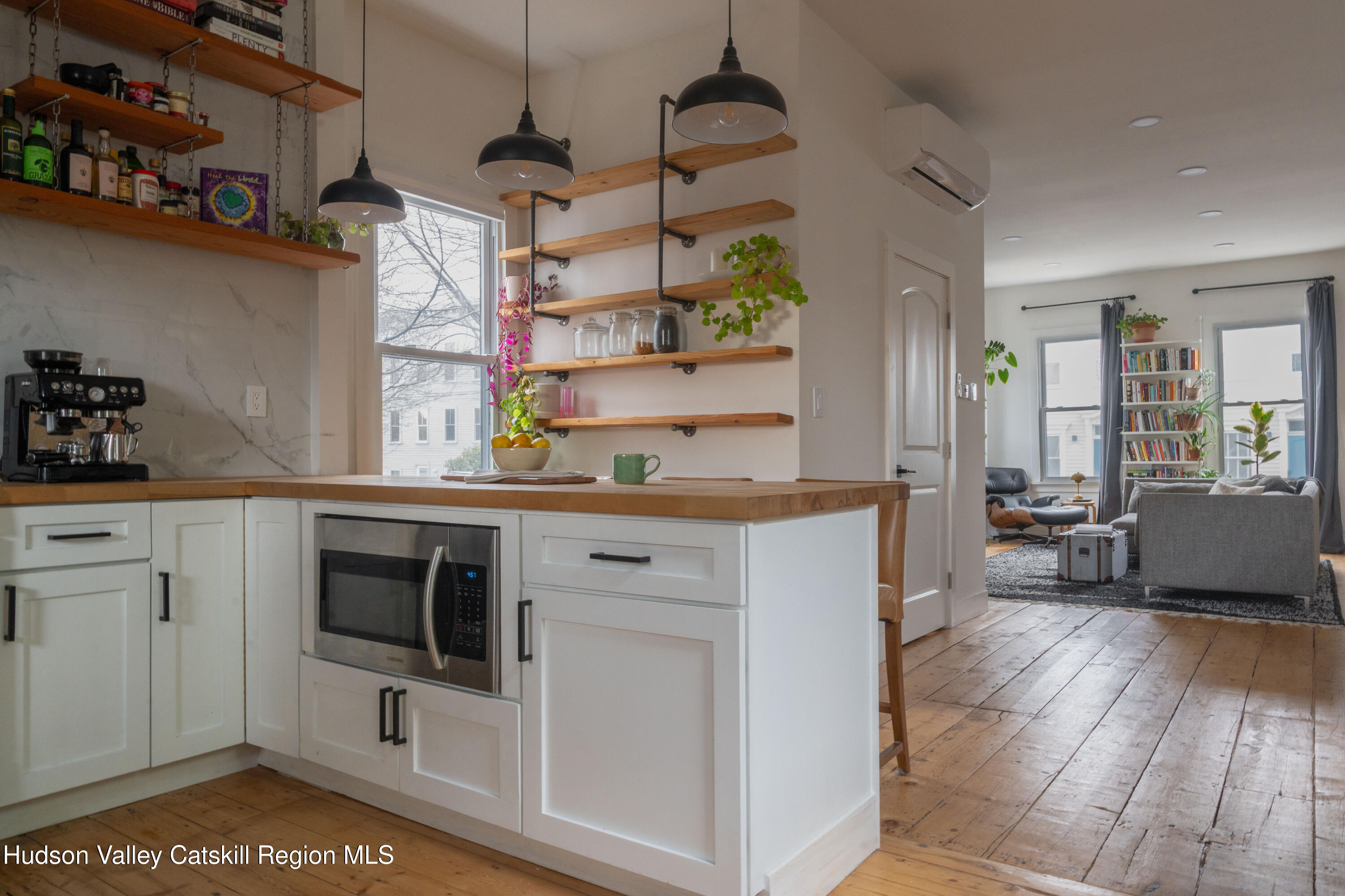 517 State Street Hudson, NY 12534 - Photo 5 of 36 a kitchen with stainless steel appliances granite countertop a stove and cabinets