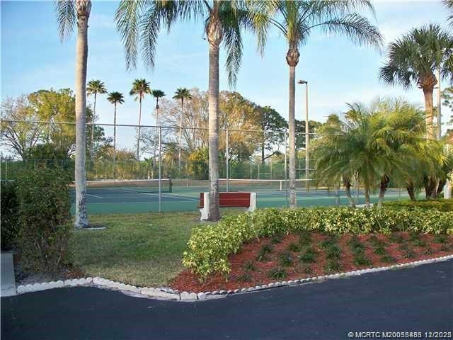 2114 Southwest Silver Pine Way, Unit 121F1 Palm City, FL 34990 - Photo 13 of 13 a view of a garden with palm trees