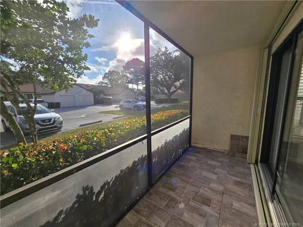 a view of balcony with wooden floor