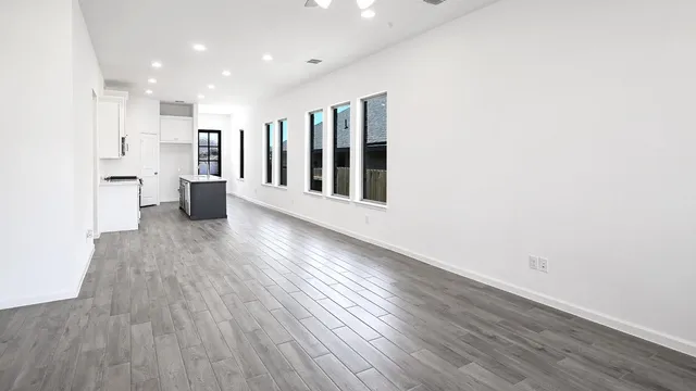 a view of a swimming pool with lawn chairs