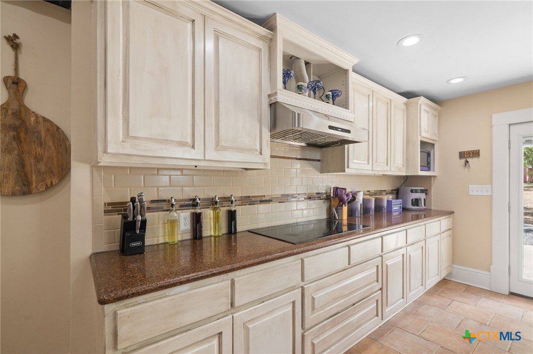 612 Wilbern Street Runge, TX 78151 - Photo 11 of 33 a kitchen with stainless steel appliances granite countertop a sink and cabinets
