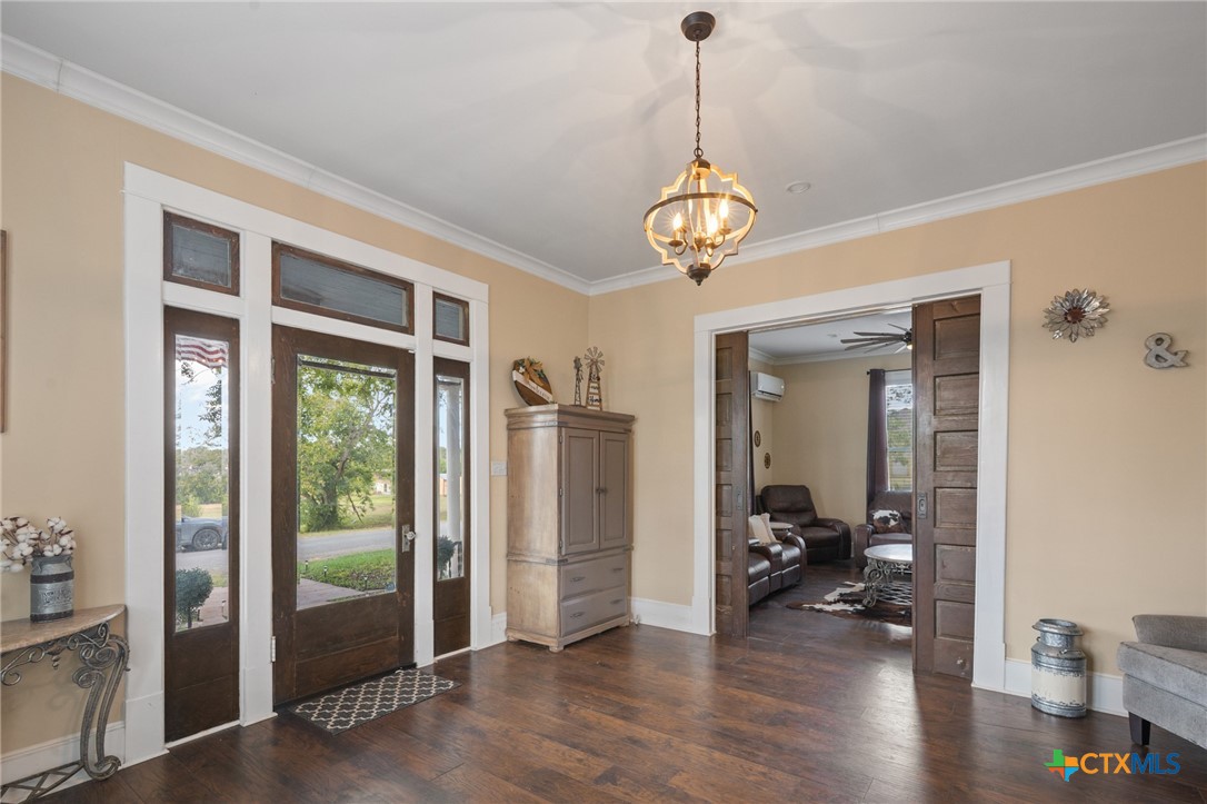 612 Wilbern Street Runge, TX 78151 - Photo 15 of 33 a view of a livingroom with wooden floor and workspace