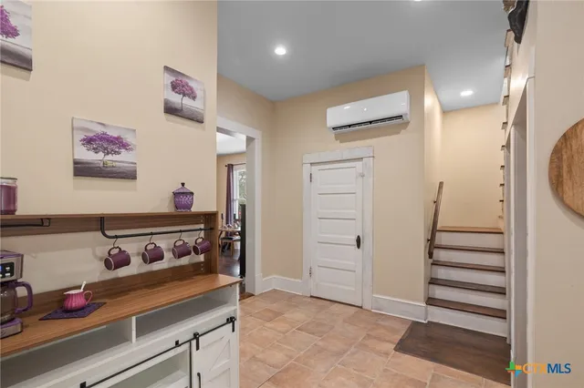 a bathroom with a sink vanity and a mirror