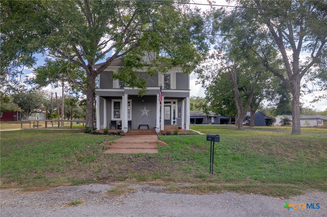612 Wilbern Street Runge, TX 78151 - Photo 25 of 33 a front view of a house with a yard and trees