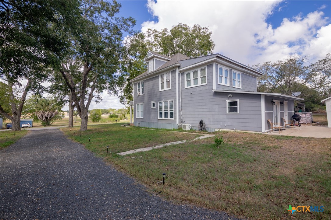 612 Wilbern Street Runge, TX 78151 - Photo 27 of 33 a front view of a house with a garden