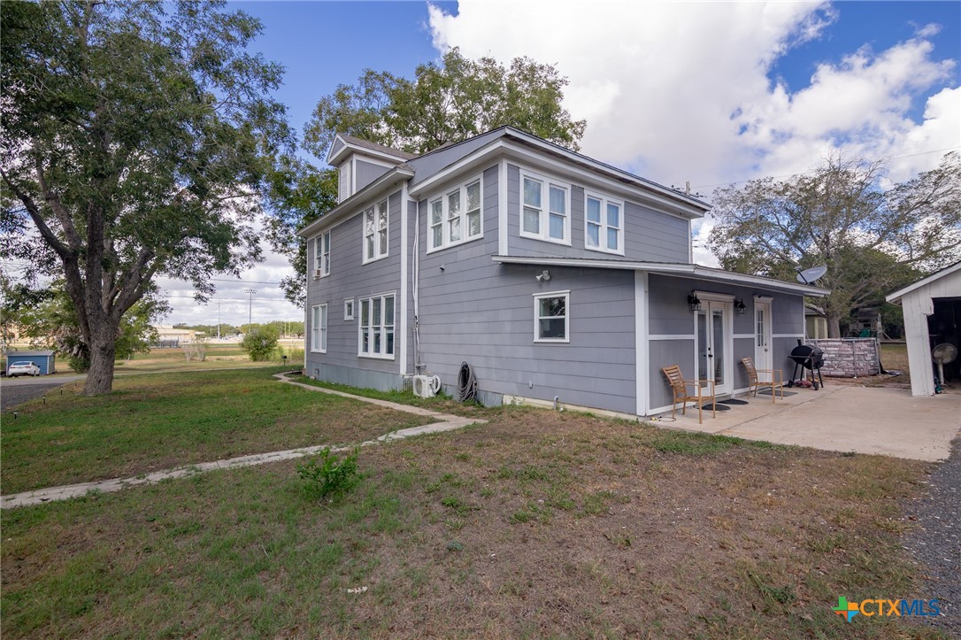 612 Wilbern Street Runge, TX 78151 - Photo 29 of 33 a view of a house with a yard and large tree