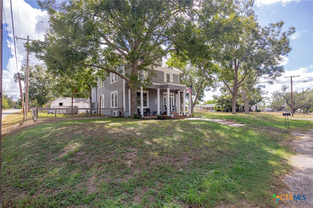 612 Wilbern Street Runge, TX 78151 - Photo 30 of 33 a front view of a house with garden