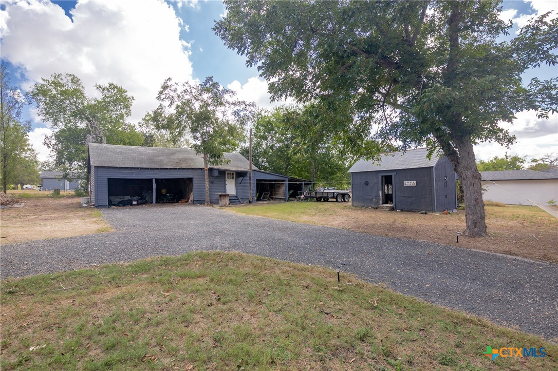 612 Wilbern Street Runge, TX 78151 - Photo 8 of 33 a front view of a house with a yard and garage
