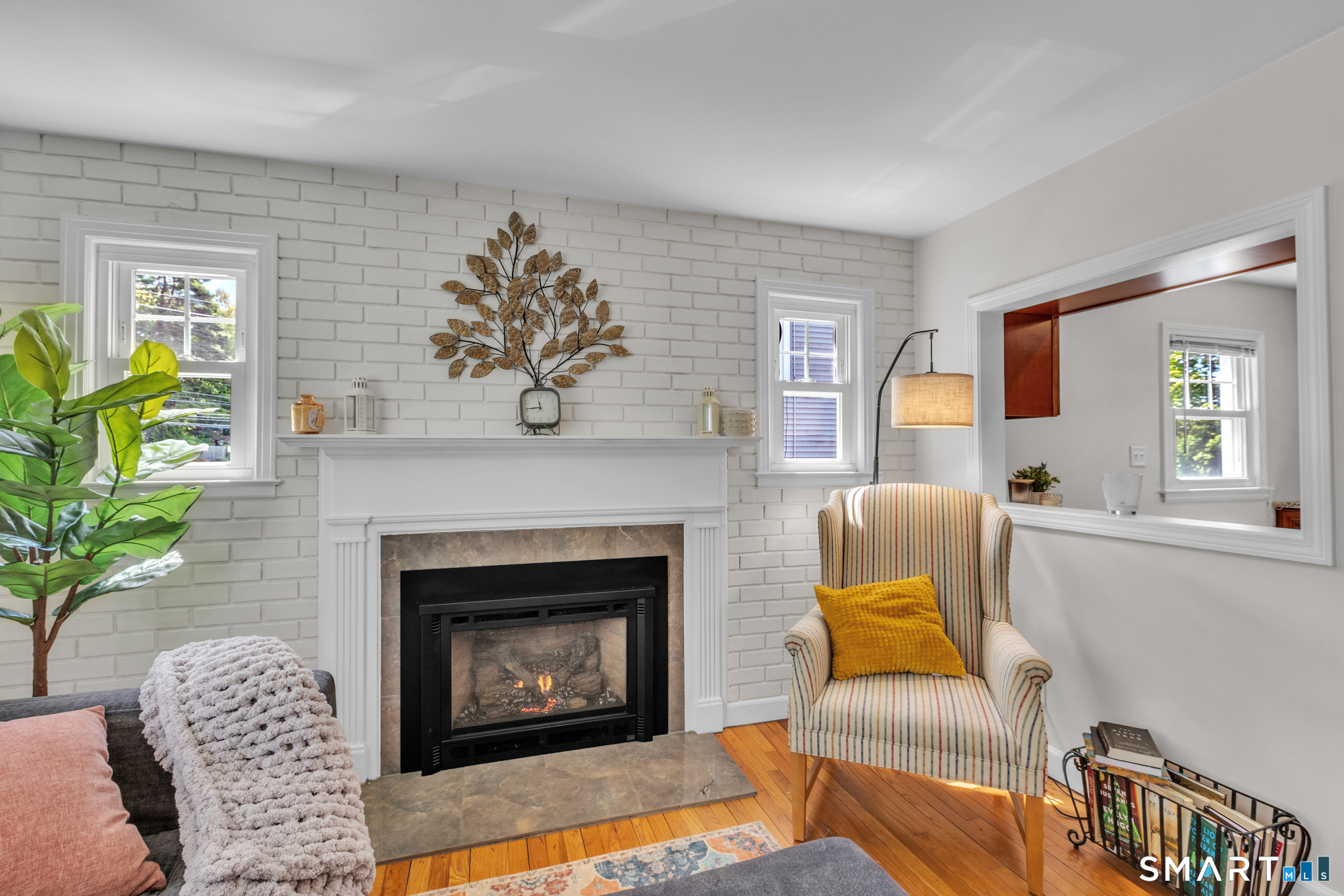 597 Wolcott Hill Road Wethersfield, CT 06109 - Photo 12 of 35 a living room with furniture and a fireplace