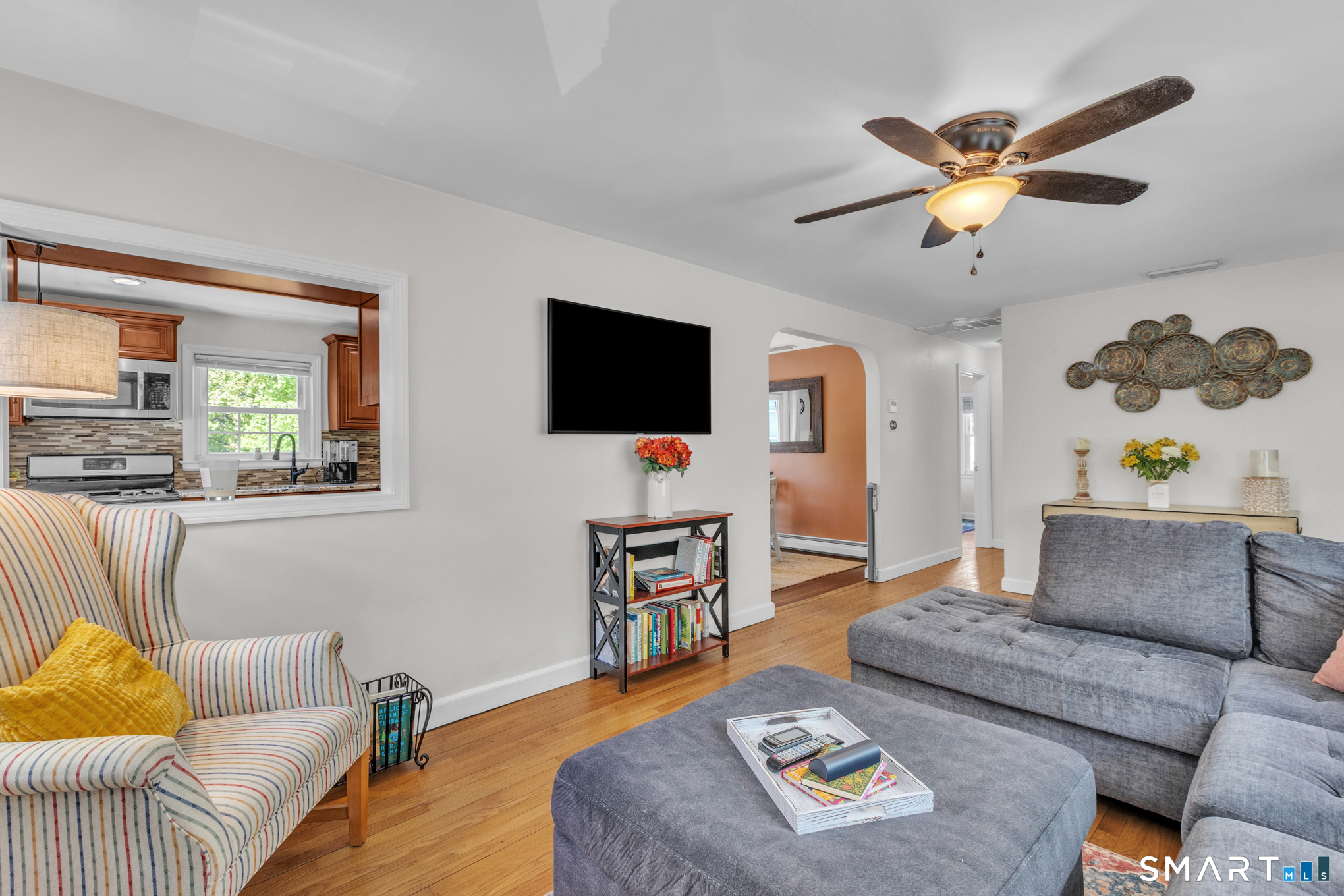 597 Wolcott Hill Road Wethersfield, CT 06109 - Photo 14 of 35 a living room with furniture and a flat screen tv