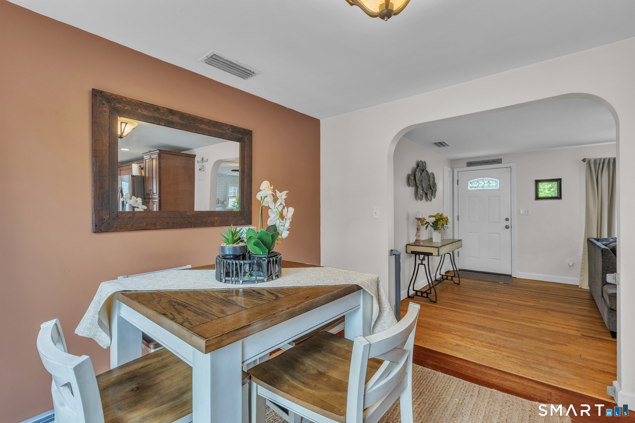597 Wolcott Hill Road Wethersfield, CT 06109 - Photo 17 of 35 a dining room with a table and chairs
