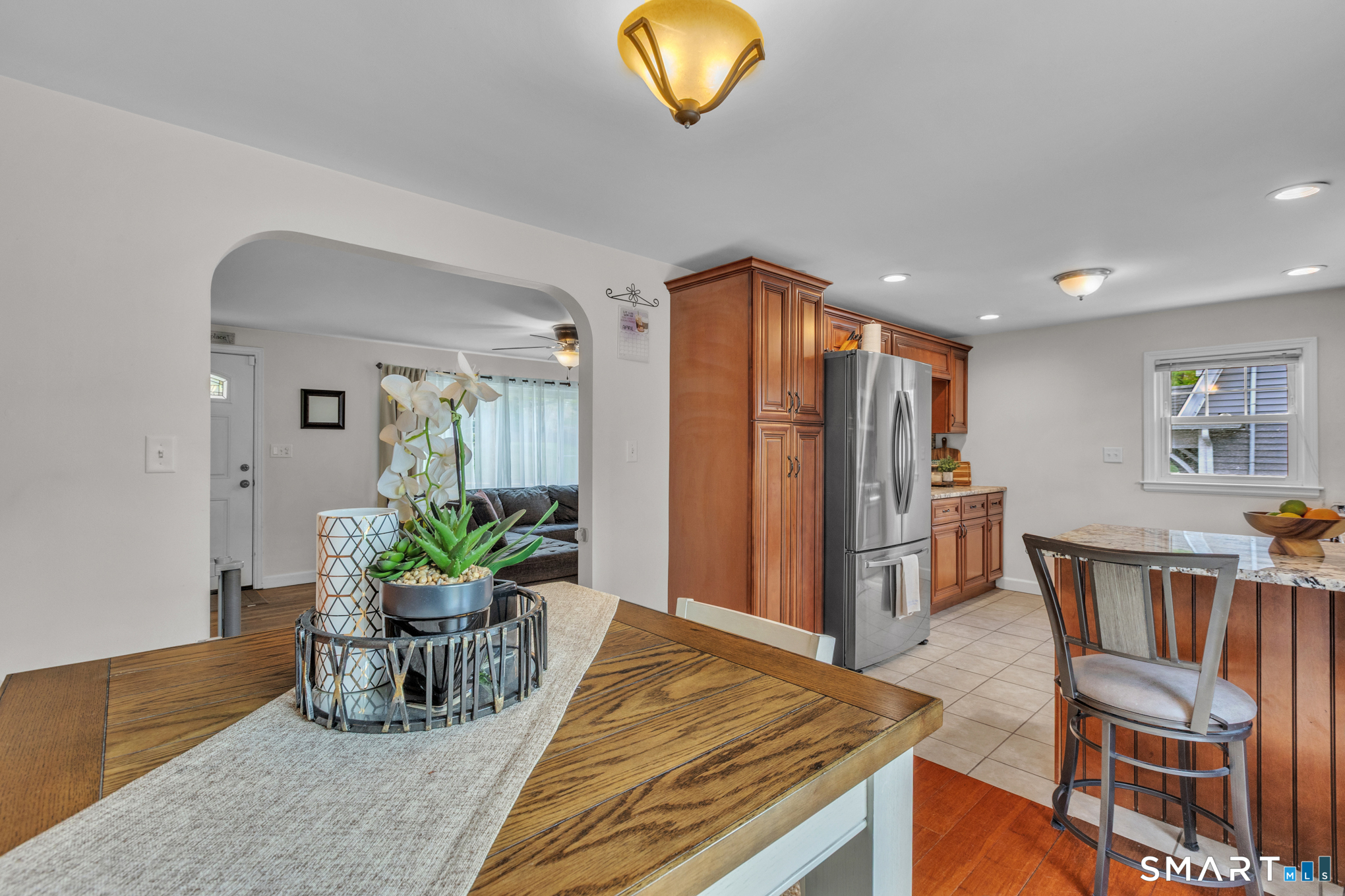 597 Wolcott Hill Road Wethersfield, CT 06109 - Photo 18 of 35 a dining room with furniture and chandelier