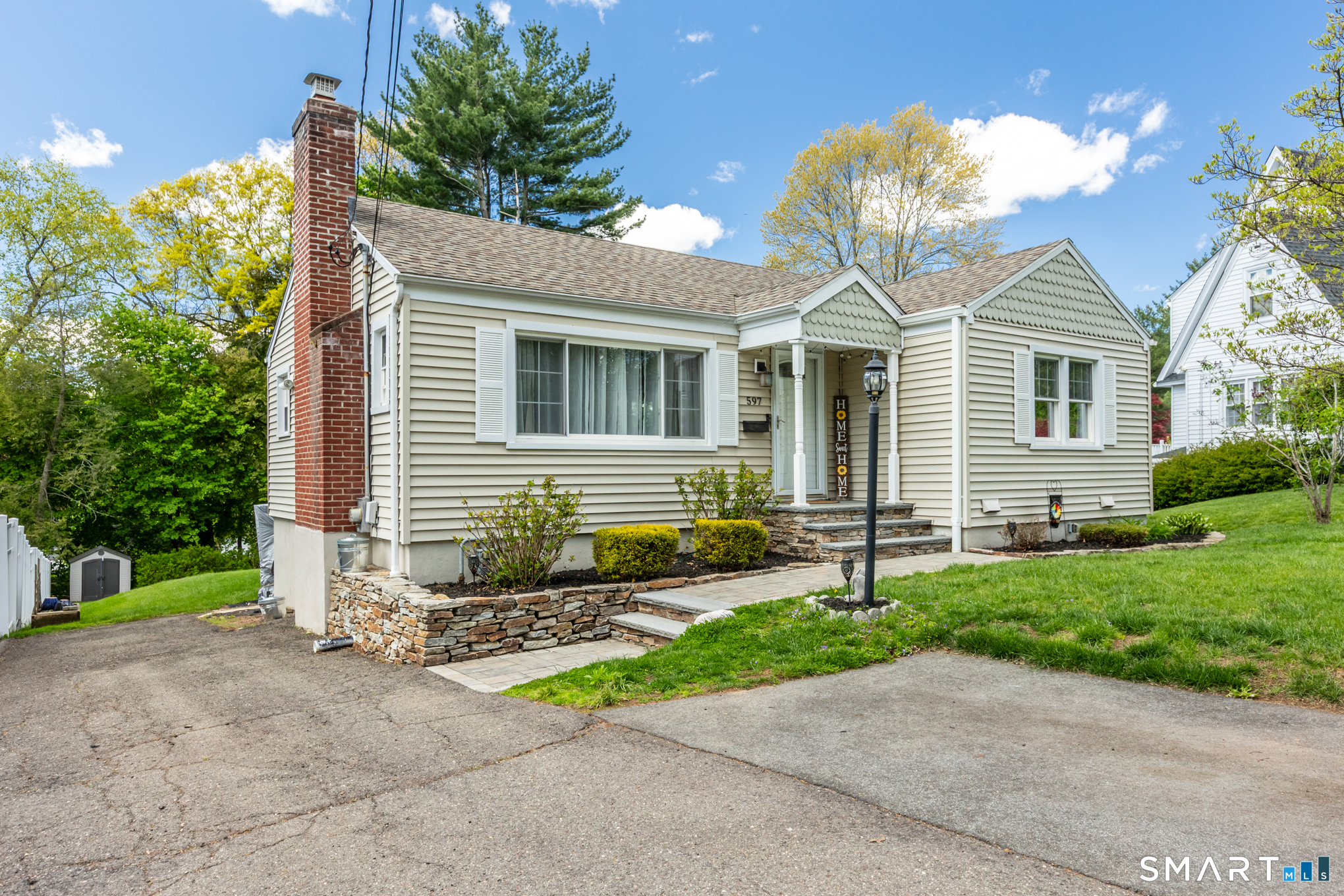 597 Wolcott Hill Road Wethersfield, CT 06109 - Photo 2 of 35 a front view of a house with garden