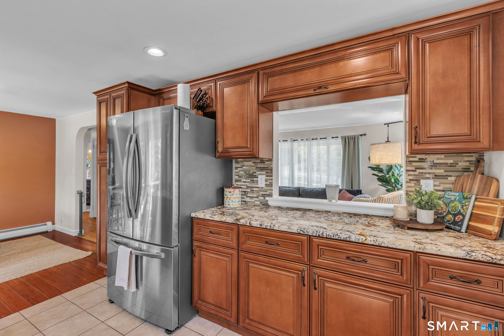 597 Wolcott Hill Road Wethersfield, CT 06109 - Photo 22 of 35 a kitchen with stainless steel appliances granite countertop a refrigerator and a sink