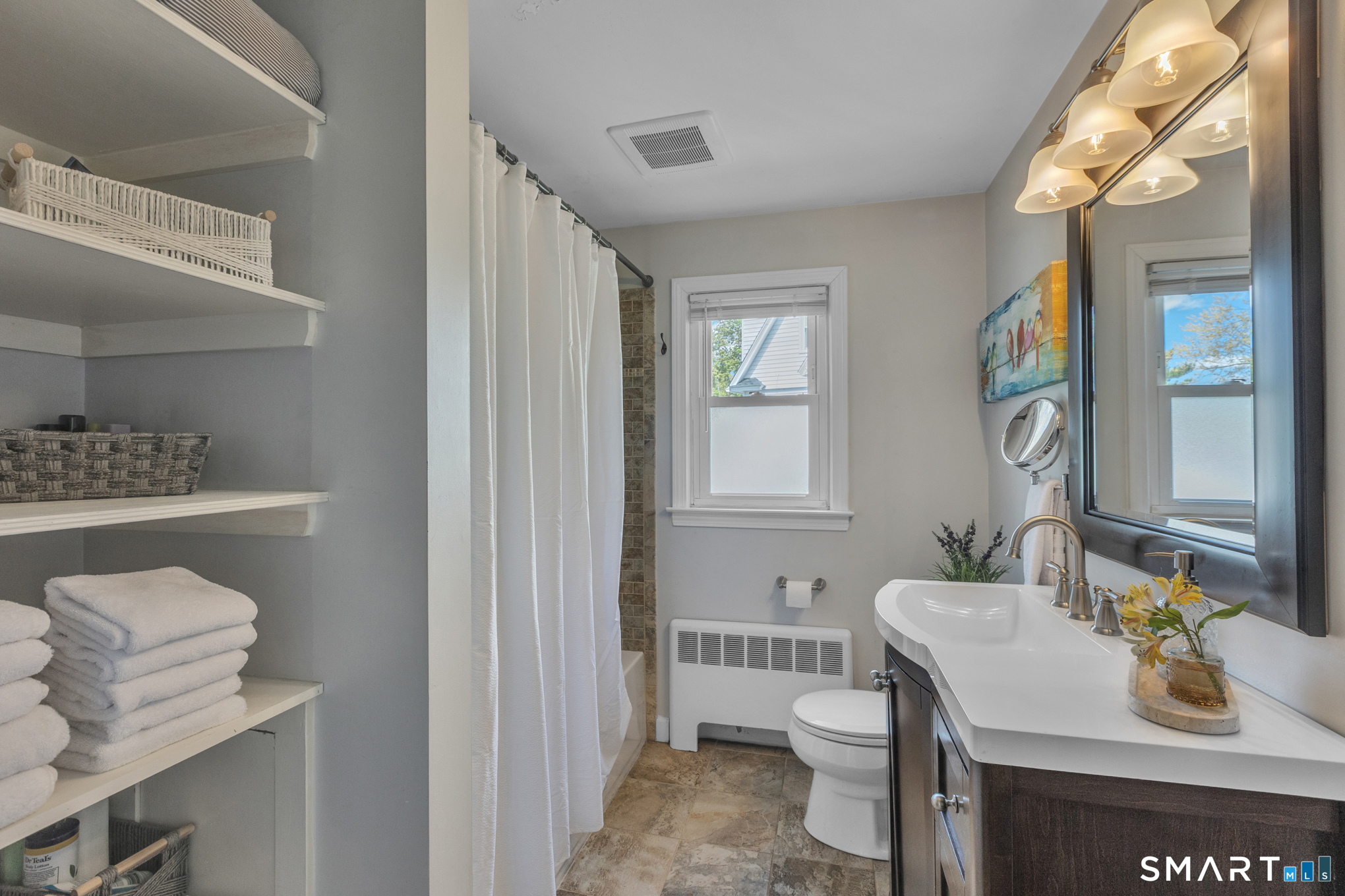 597 Wolcott Hill Road Wethersfield, CT 06109 - Photo 26 of 35 a bathroom with a sink toilet and shower