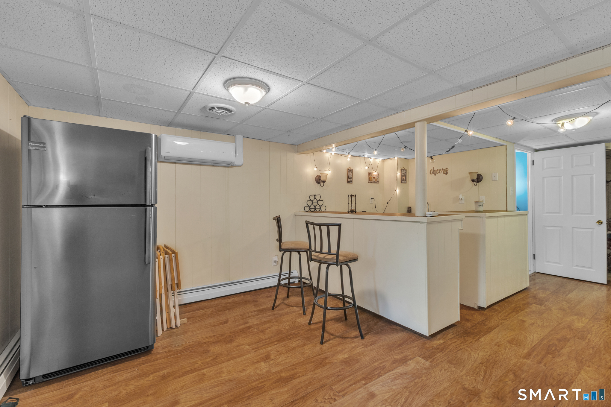 597 Wolcott Hill Road Wethersfield, CT 06109 - Photo 31 of 35 a kitchen with stainless steel appliances granite countertop a refrigerator a stove and a wooden floors