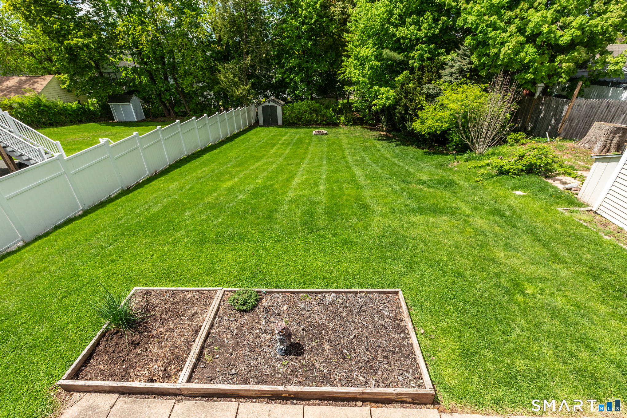 597 Wolcott Hill Road Wethersfield, CT 06109 - Photo 6 of 35 a view of a back yard