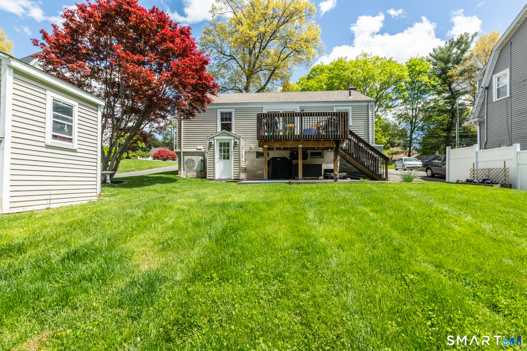 597 Wolcott Hill Road Wethersfield, CT 06109 - Photo 8 of 35 a view of a house with a yard and sitting area