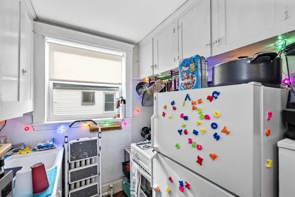 a room with toys and a refrigerator