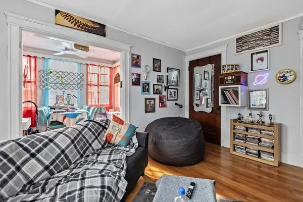 a bedroom with furniture and a window