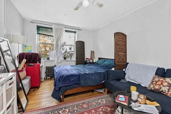a living room with furniture rug and window