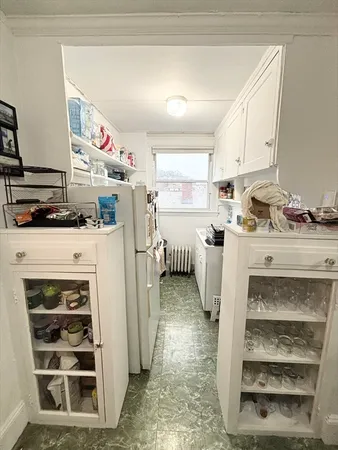 a kitchen with stainless steel appliances a stove a sink and a refrigerator