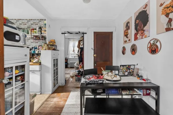 a view of a dining room with furniture and rug