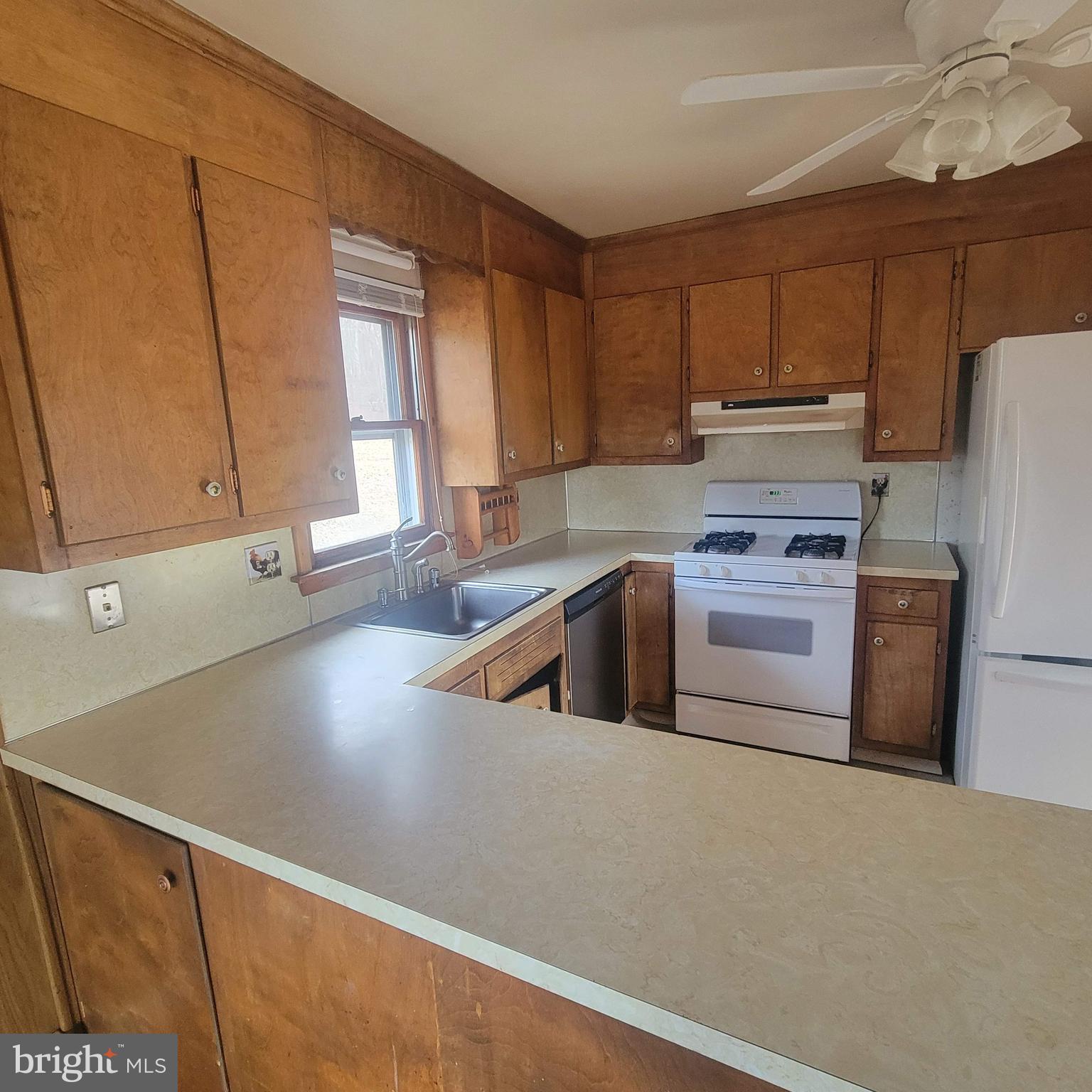 4227 Rupp Road Manchester, MD 21102 - Photo 12 of 31 a kitchen with stainless steel appliances white cabinets and a refrigerator