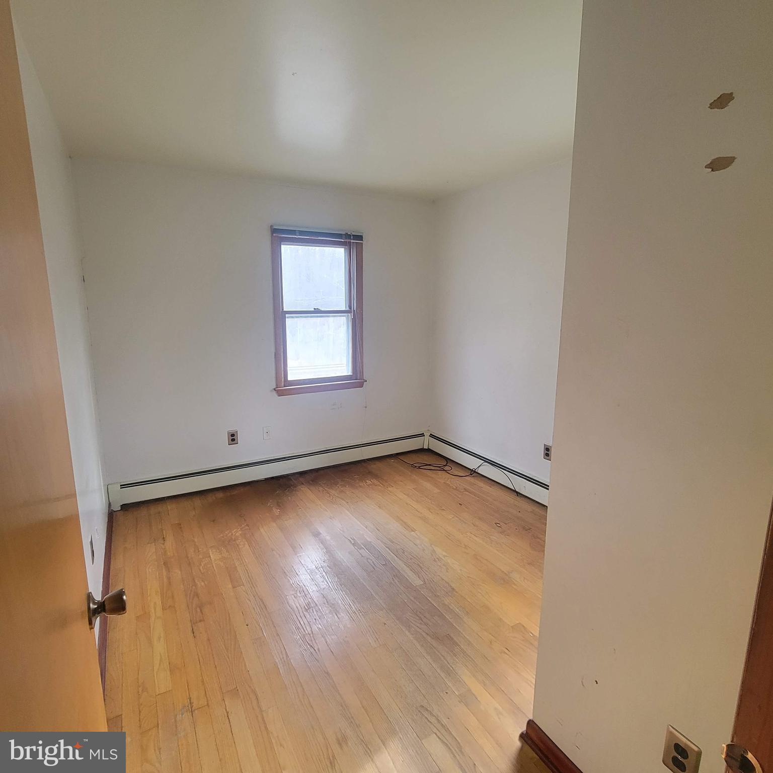 4227 Rupp Road Manchester, MD 21102 - Photo 13 of 31 an empty room with wooden floor and windows