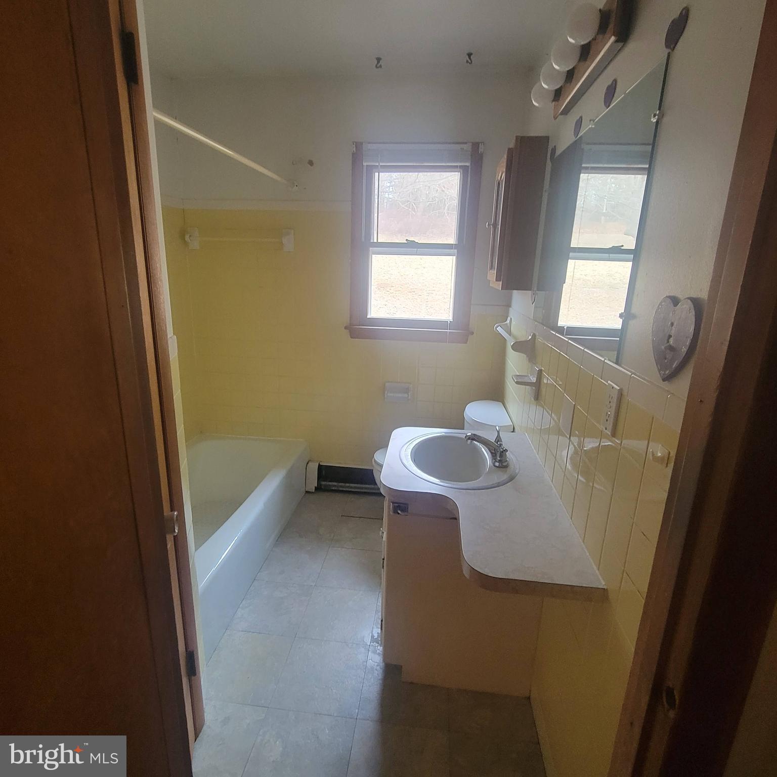 4227 Rupp Road Manchester, MD 21102 - Photo 17 of 31 a bathroom with a sink and mirror