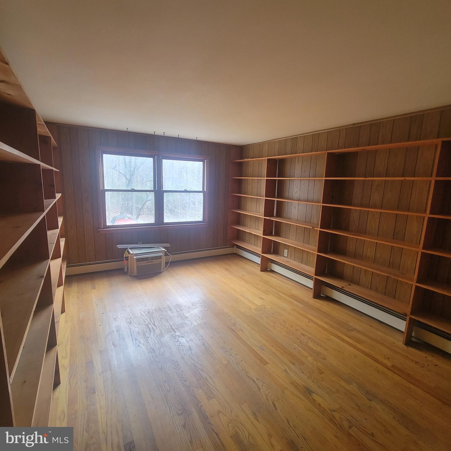 4227 Rupp Road Manchester, MD 21102 - Photo 24 of 31 an empty room with wooden floor and windows
