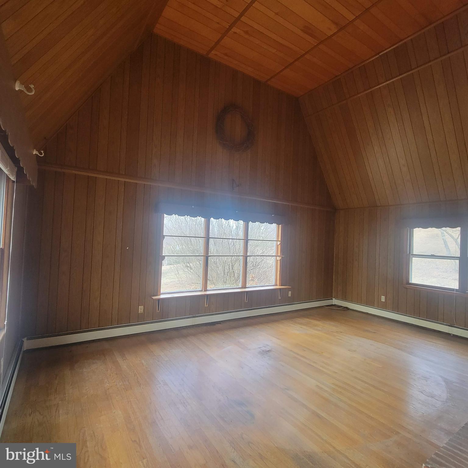 4227 Rupp Road Manchester, MD 21102 - Photo 9 of 31 an empty room with wooden floor and windows