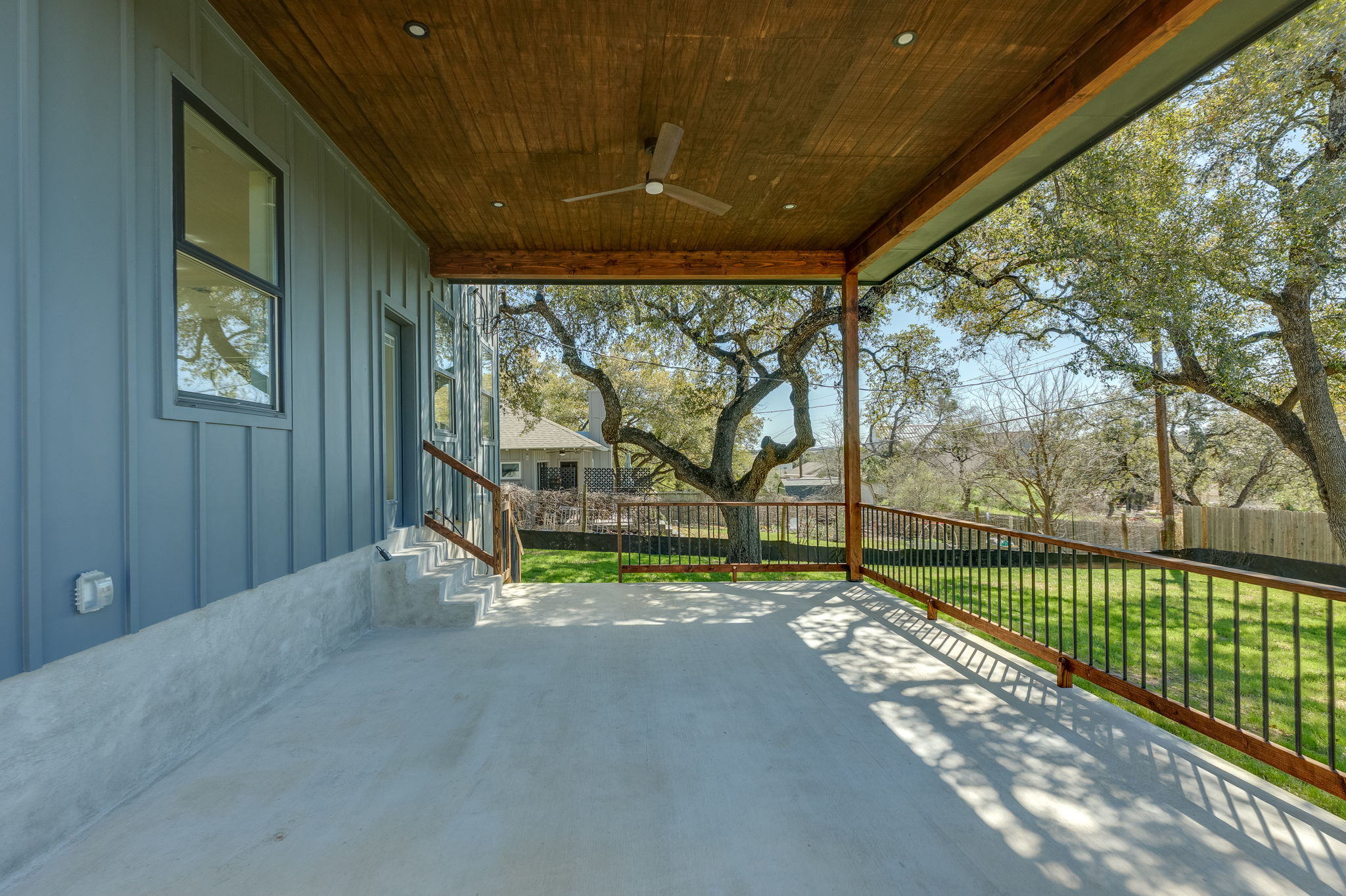 3014 Brass Buttons Trail Austin, TX 78734 - Photo 30 of 35 Backyard covered porch with heritage live oak trees.