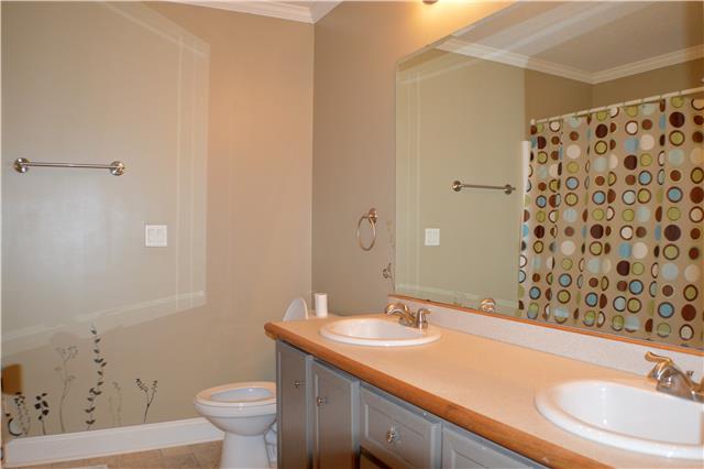 392 Joslin Branch Road White Bluff, TN 37187 - Photo 14 of 17 Full guest bathroom showing double vanities.